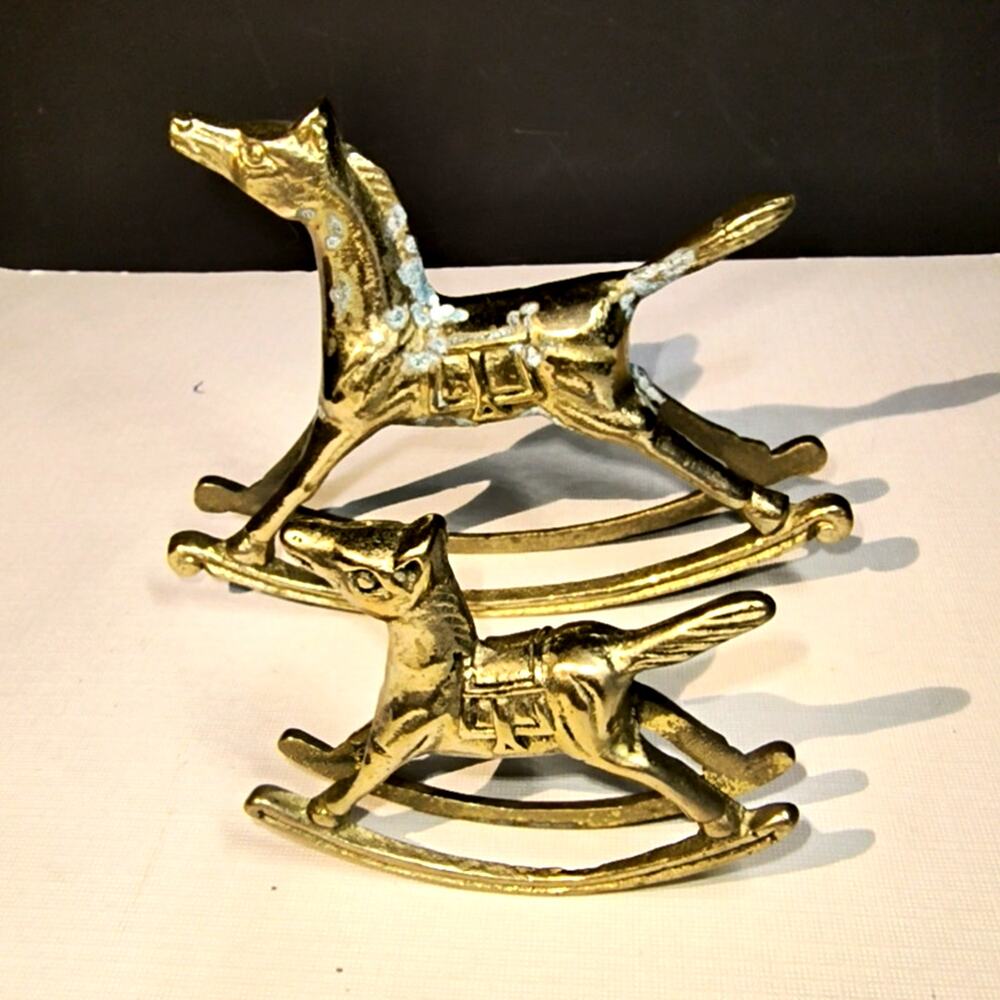 1587.  Set Brass Rocking Horses